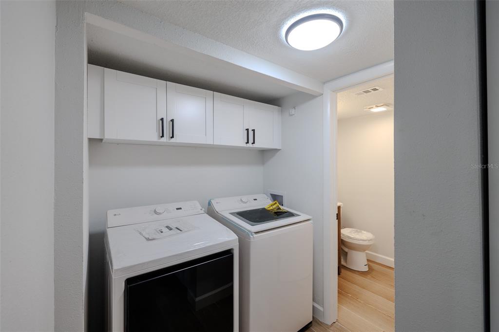 11033 Springridge Drive Tampa, FL 33624 - Photo 17 of 33 a view of utility room with washer and dryer