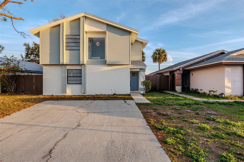 11033 Springridge Drive Tampa, FL 33624 - Photo 22 of 33 a front view of house with yard