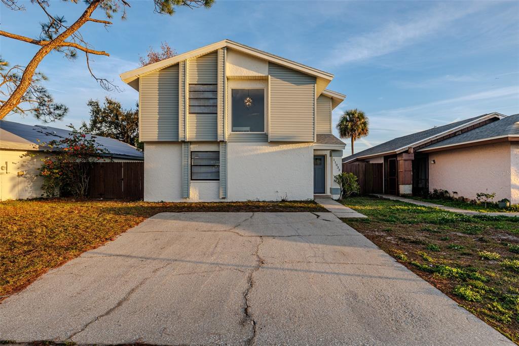11033 Springridge Drive Tampa, FL 33624 - Photo 24 of 33 a front view of a house with garden