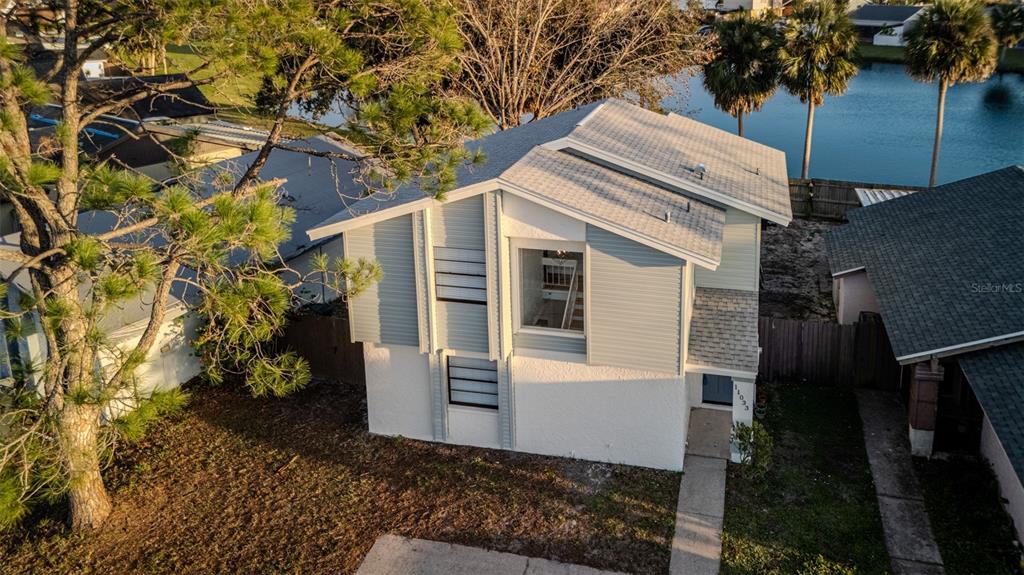 11033 Springridge Drive Tampa, FL 33624 - Photo 25 of 33 a view of house along with trees