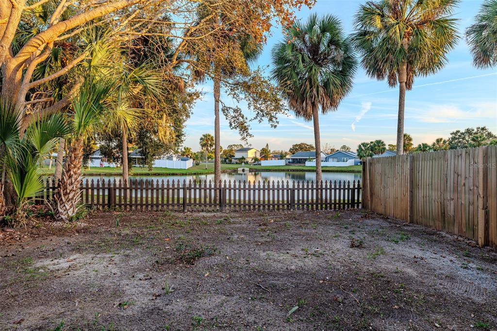 11033 Springridge Drive Tampa, FL 33624 - Photo 33 of 33 a view of a garden with a fence