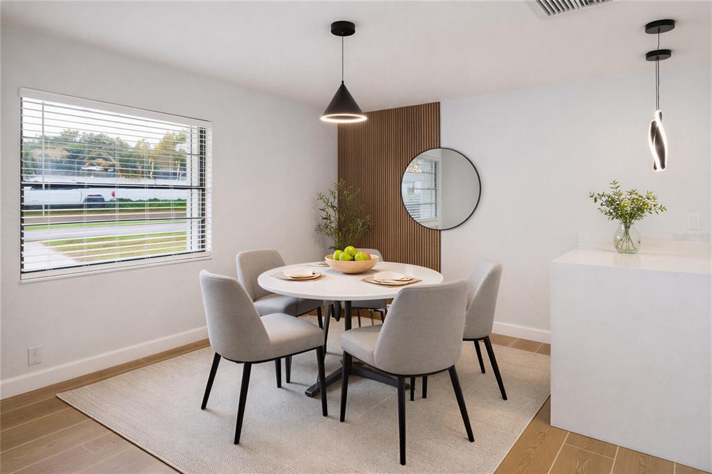 11033 Springridge Drive Tampa, FL 33624 - Photo 5 of 33 a dining room with furniture and wooden floor
