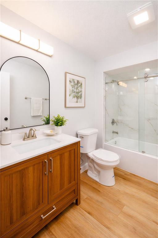 11033 Springridge Drive Tampa, FL 33624 - Photo 10 of 33 a bathroom with a sink a toilet and shower