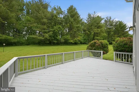 a view of balcony with deck and trees