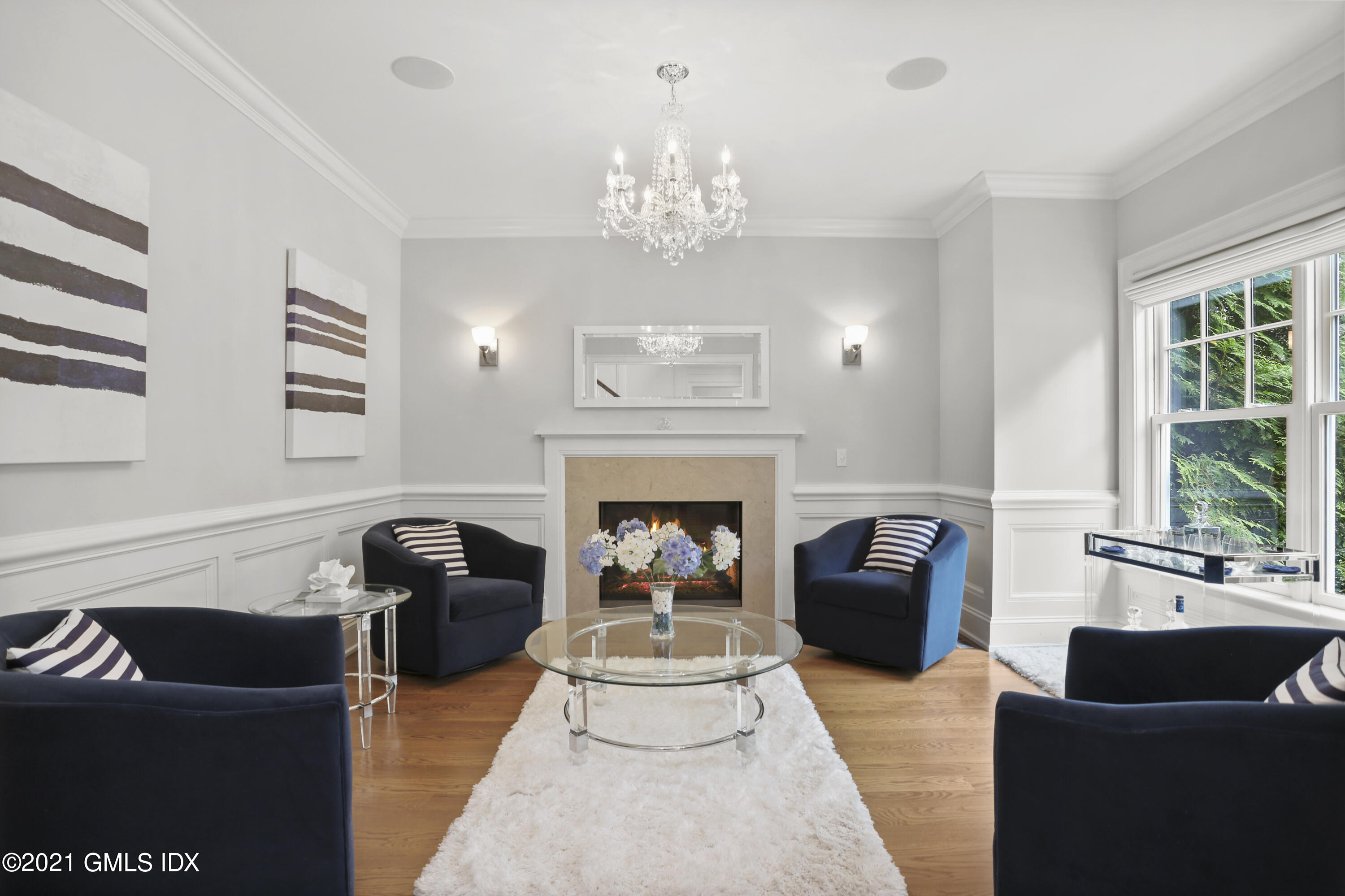 15 Terrace Avenue Riverside, CT 06878 - Photo 11 of 27 a living room with furniture a chandelier and a fireplace