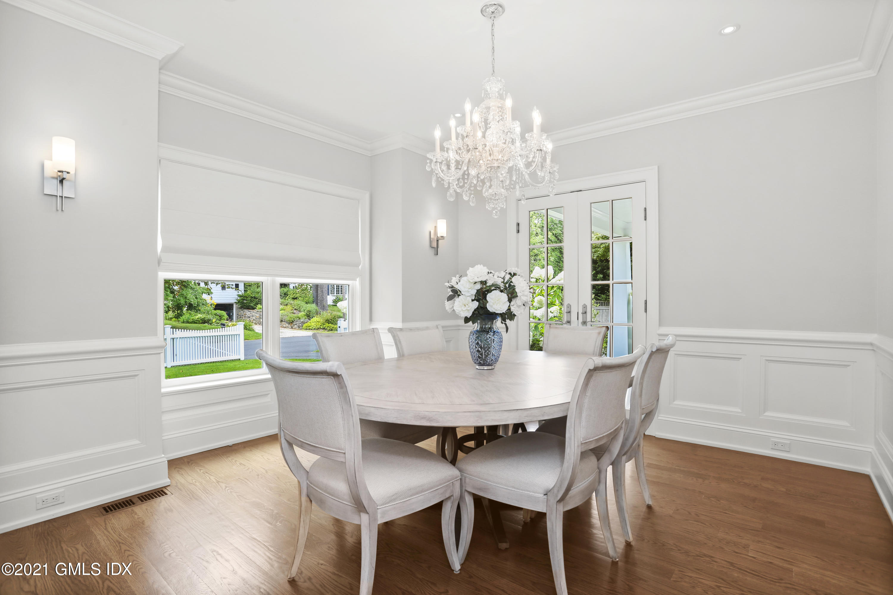 15 Terrace Avenue Riverside, CT 06878 - Photo 12 of 27 a view of a dining room with furniture a chandelier and wooden floor