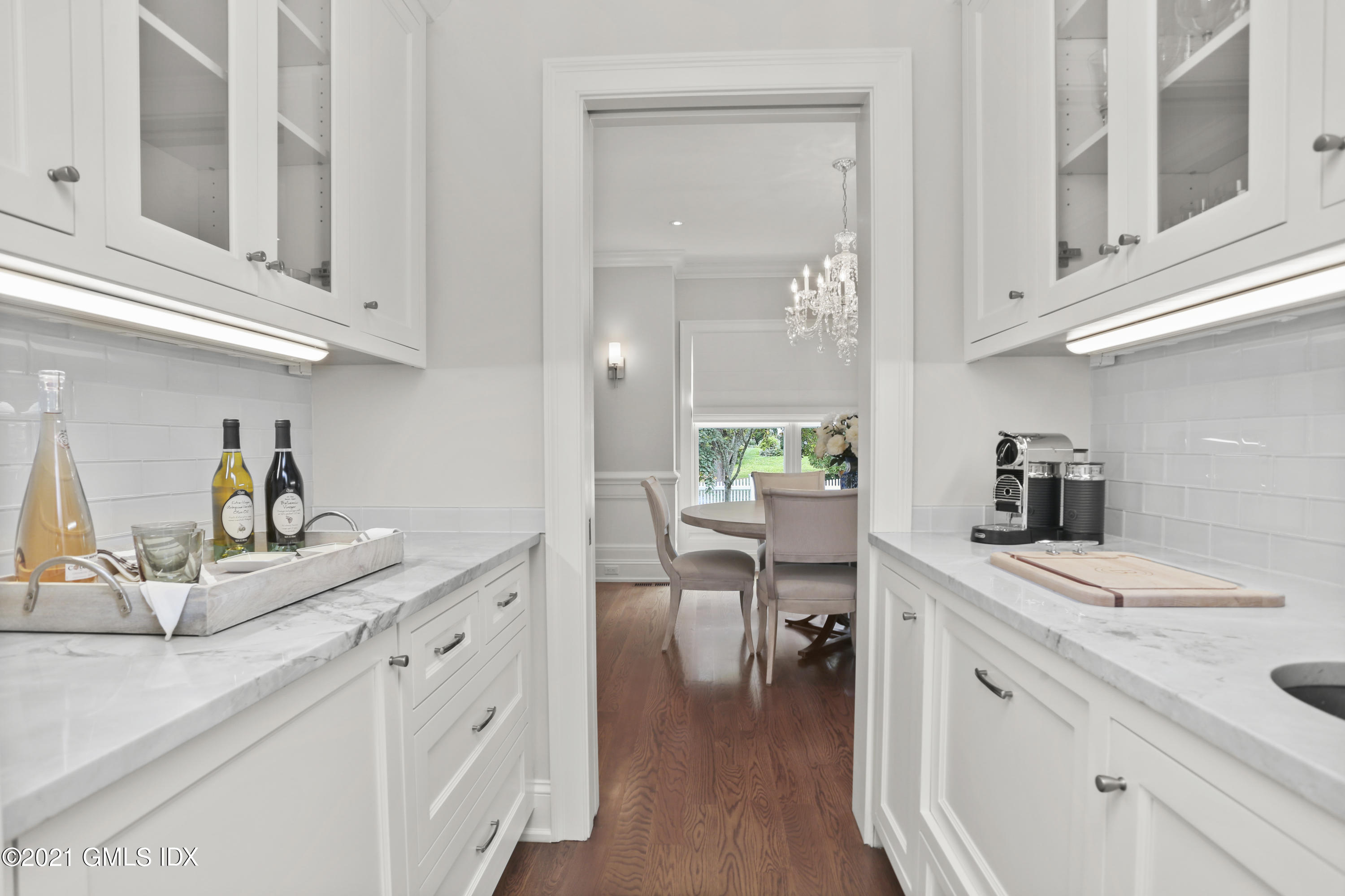 15 Terrace Avenue Riverside, CT 06878 - Photo 13 of 27 a kitchen with white cabinets and sink