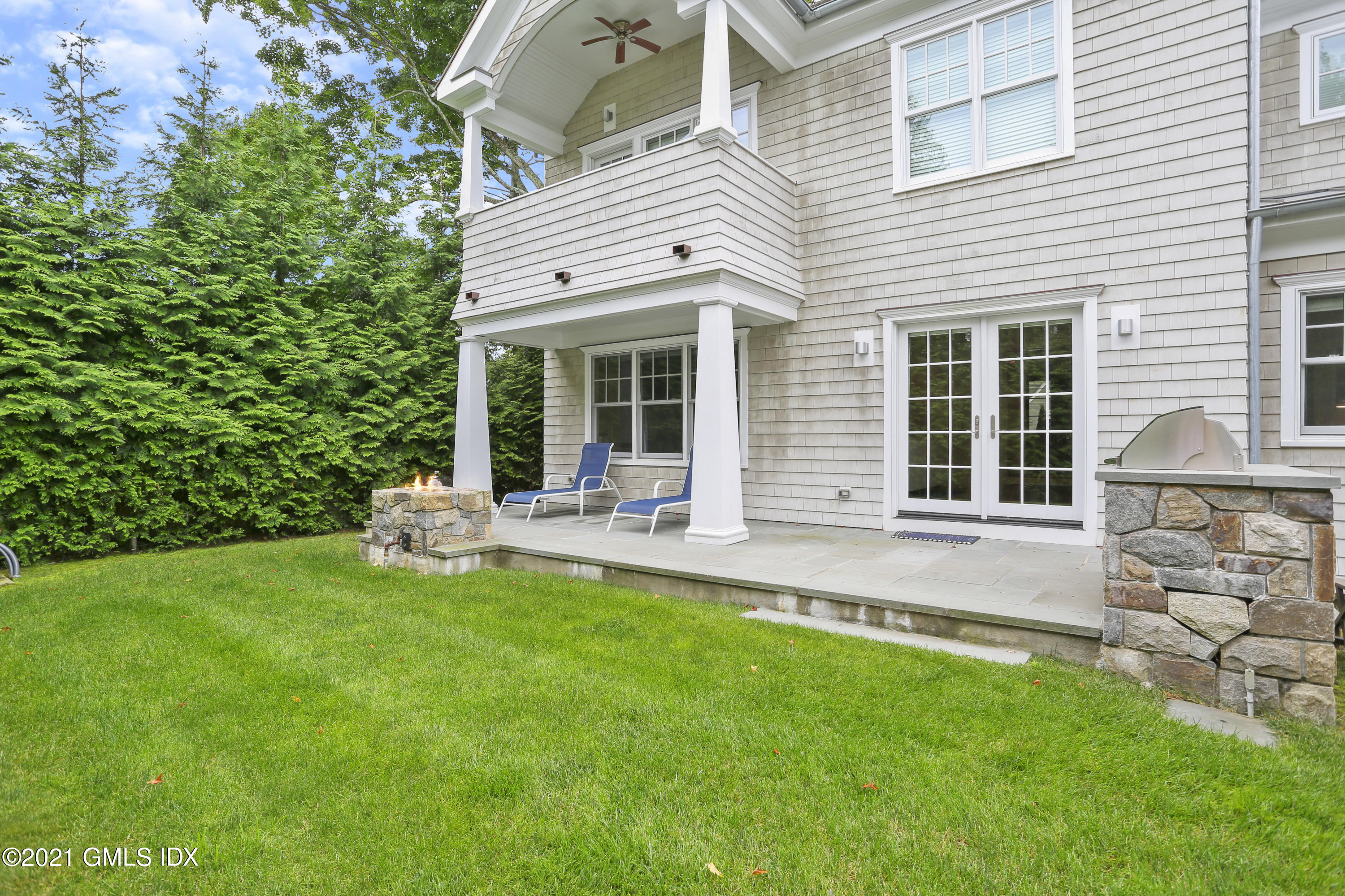 15 Terrace Avenue Riverside, CT 06878 - Photo 22 of 27 a front view of a house with a garden and yard