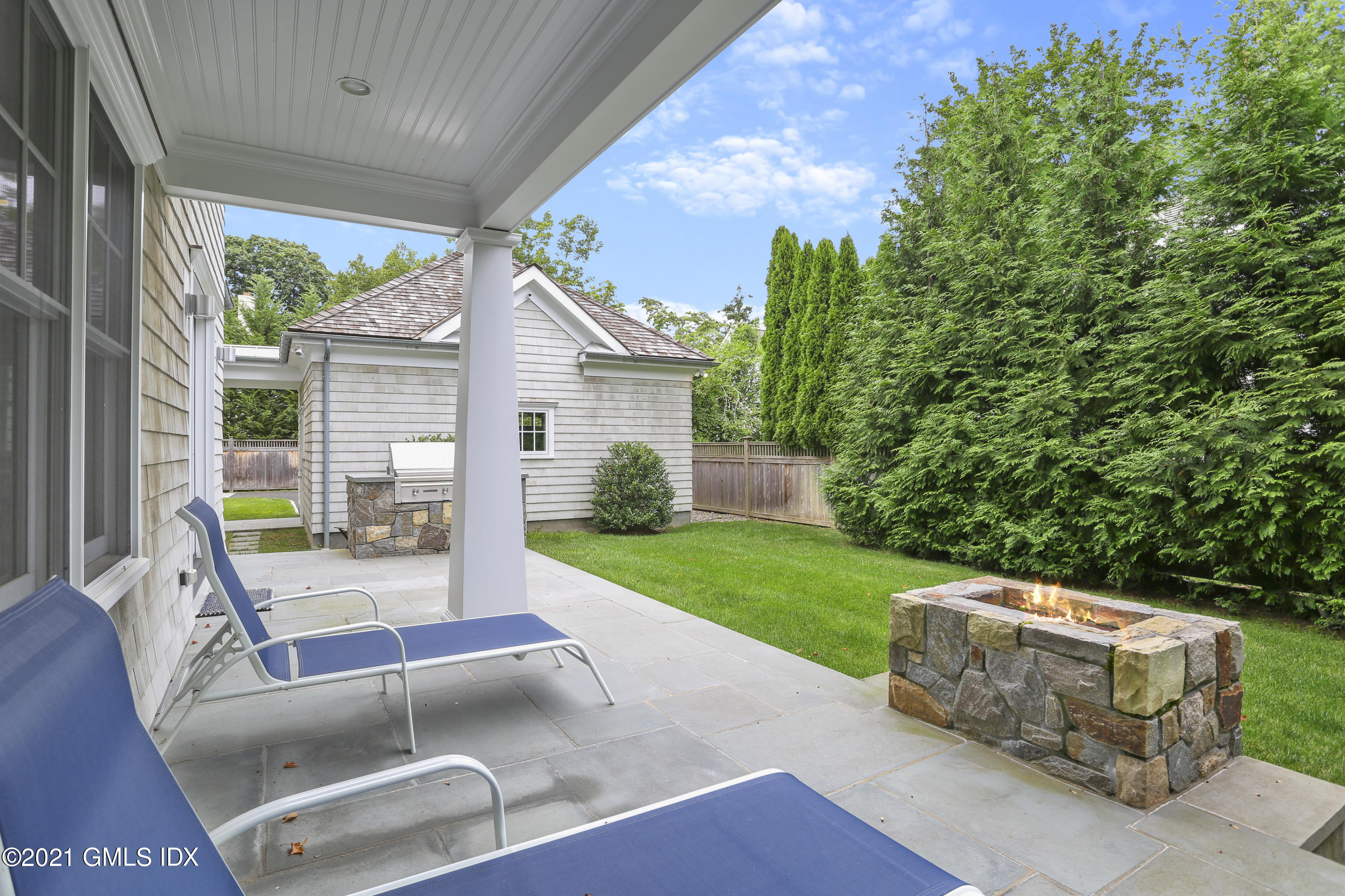 15 Terrace Avenue Riverside, CT 06878 - Photo 23 of 27 a view of a patio with table and chairs and potted plants