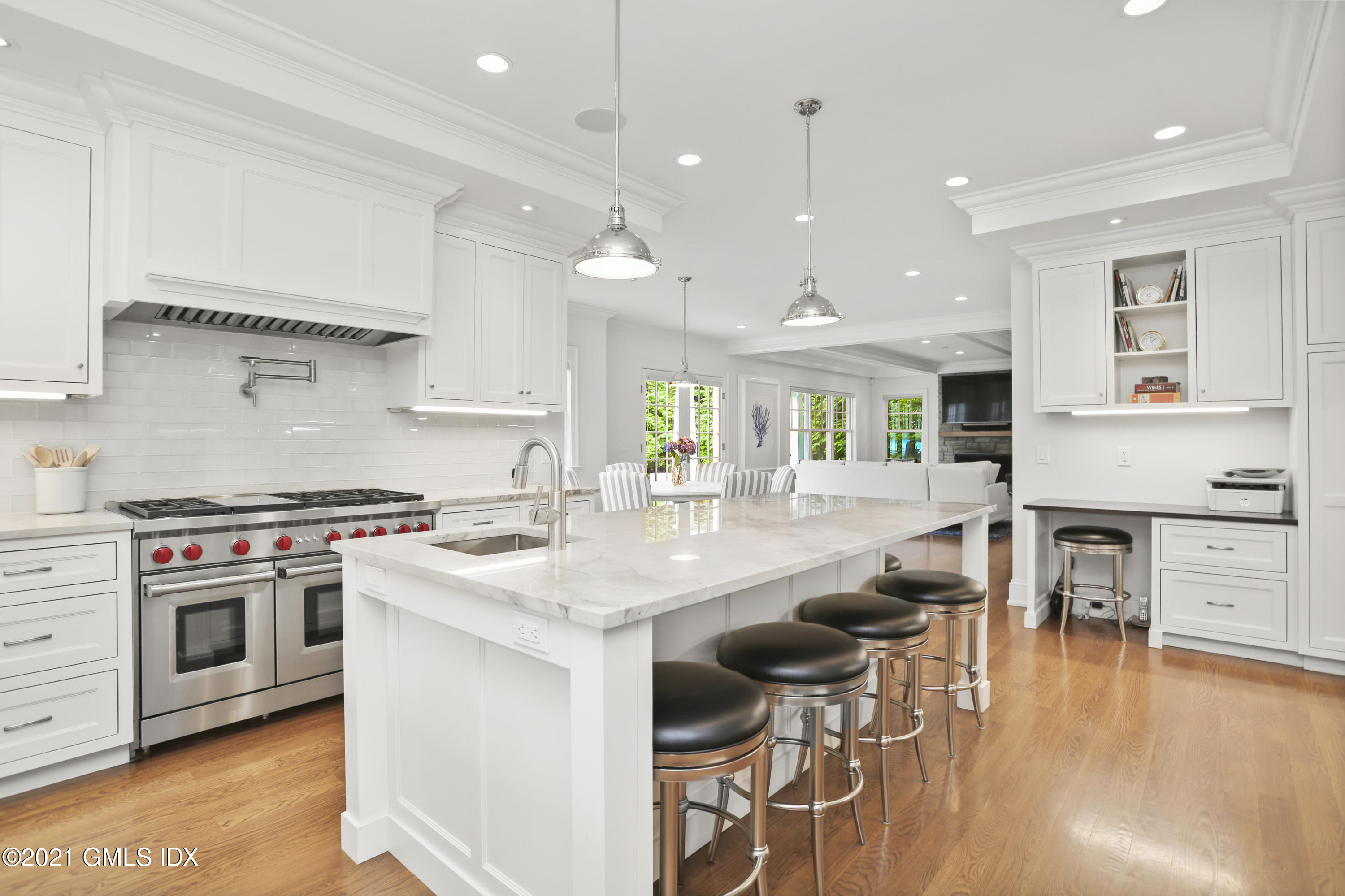 15 Terrace Avenue Riverside, CT 06878 - Photo 4 of 27 a kitchen with stainless steel appliances granite countertop a stove and a wooden floors