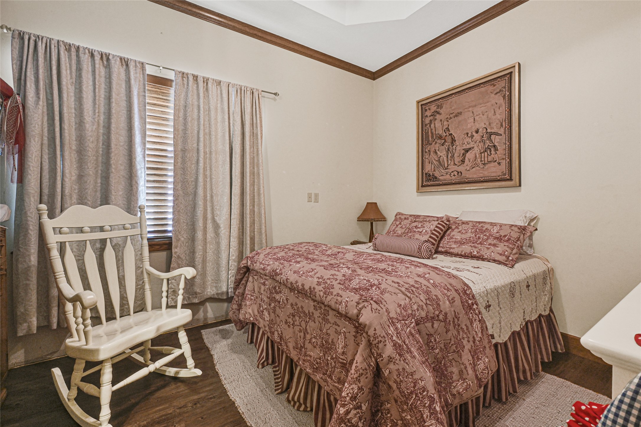 4800 Katy Hockley Road Katy, TX 77493 - Photo 13 of 24 a bedroom with a bed and a painting on the wall