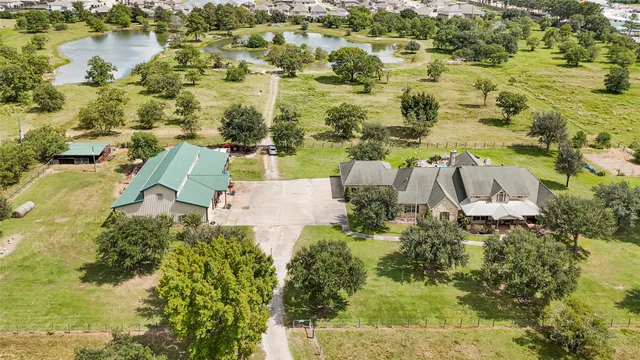 an aerial view of residential houses with outdoor space