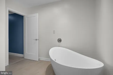 a bathroom with a white tub