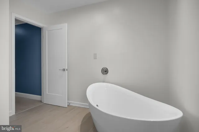 a bathroom with a white tub