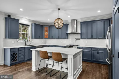 a kitchen with cabinets a sink and appliances