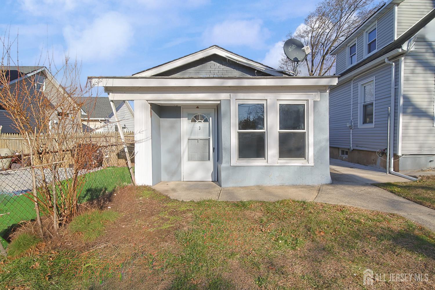 9 Rolfe Avenue Highland Park, NJ 08904 - Photo 2 of 8 a front view of a house with a garden