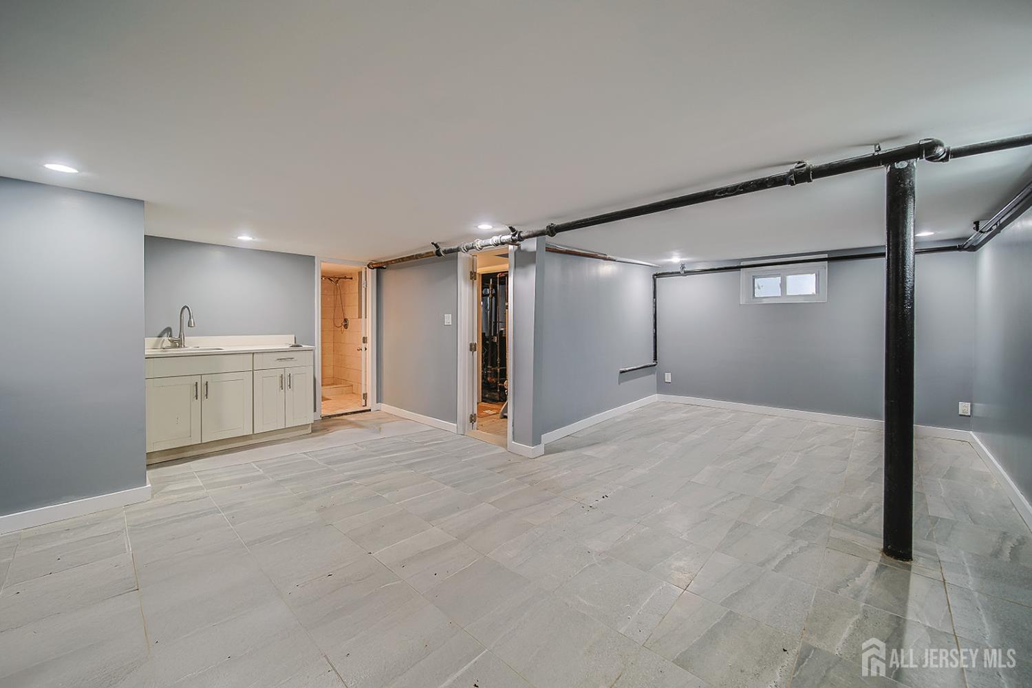 9 Rolfe Avenue Highland Park, NJ 08904 - Photo 7 of 8 a view of an empty room with a cabinet