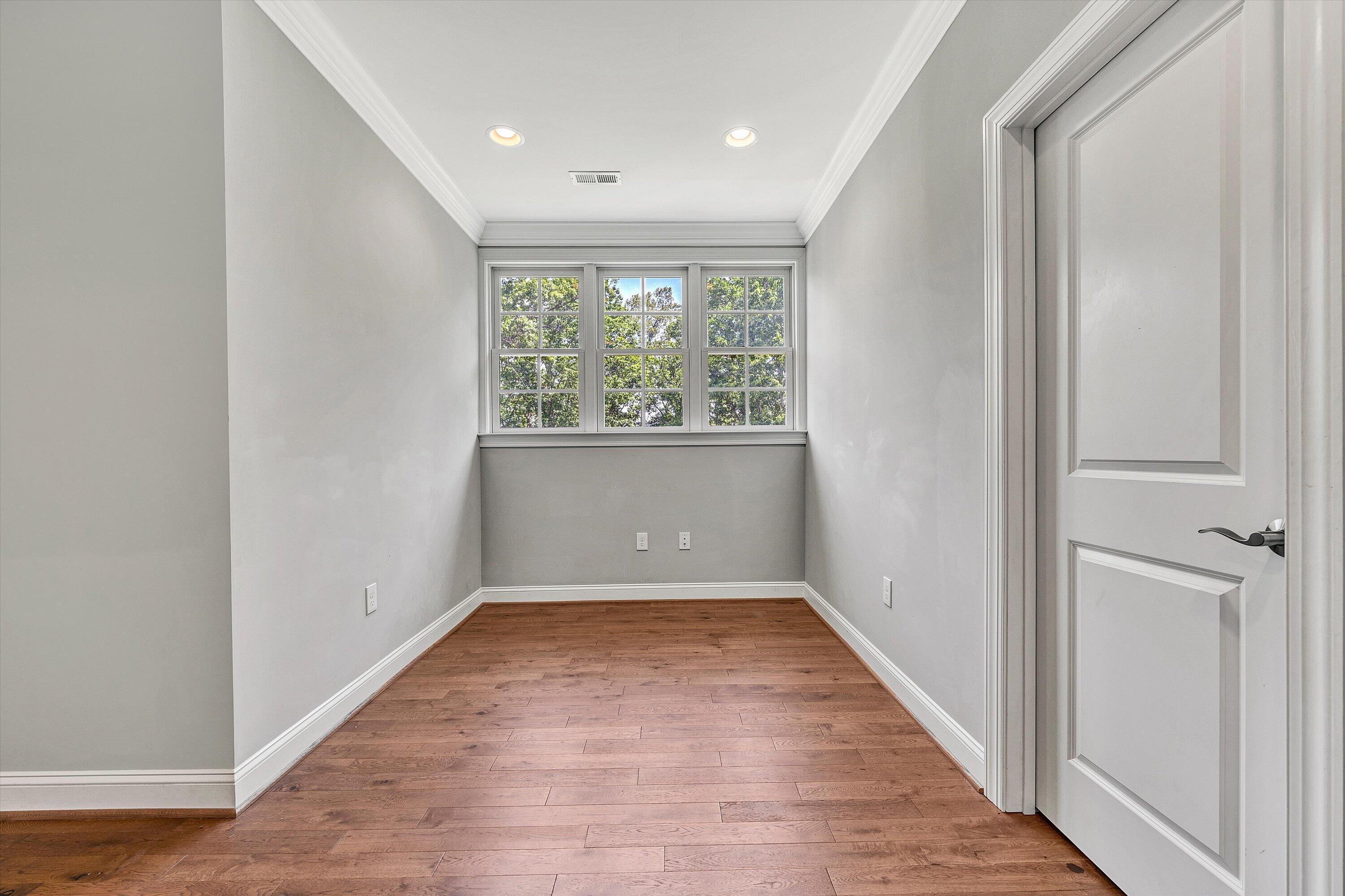 6981 Fairway Ridge Road Salem, VA 24153 - Photo 38 of 53 an empty room with wooden floor and windows