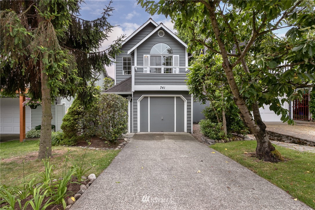 741 North 87th Street Seattle, WA 98103 - Photo 1 of 20 a front view of a house with garden