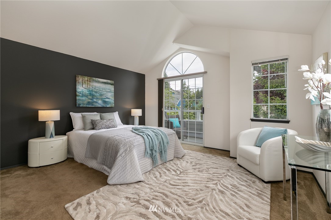 741 North 87th Street Seattle, WA 98103 - Photo 14 of 20 a bedroom with a large bed and a large window