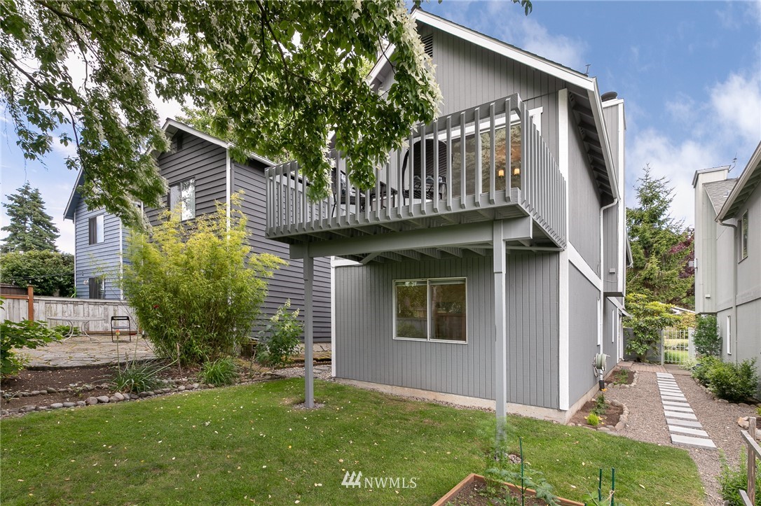 741 North 87th Street Seattle, WA 98103 - Photo 3 of 20 a front view of a house with garden