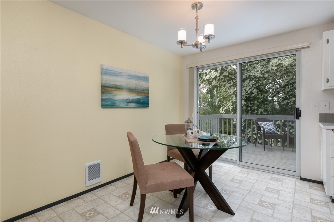 741 North 87th Street Seattle, WA 98103 - Photo 9 of 20 a dining room with furniture and window