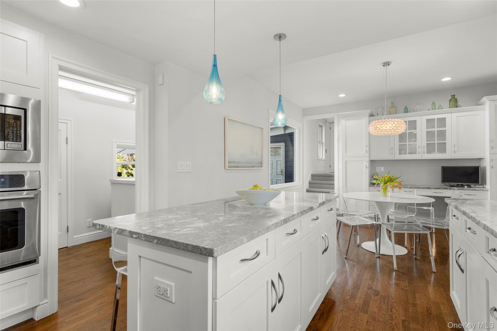 644 Fort Hill Road Scarsdale, NY 10583 - Photo 19 of 42 a kitchen with a sink stove and wooden floor
