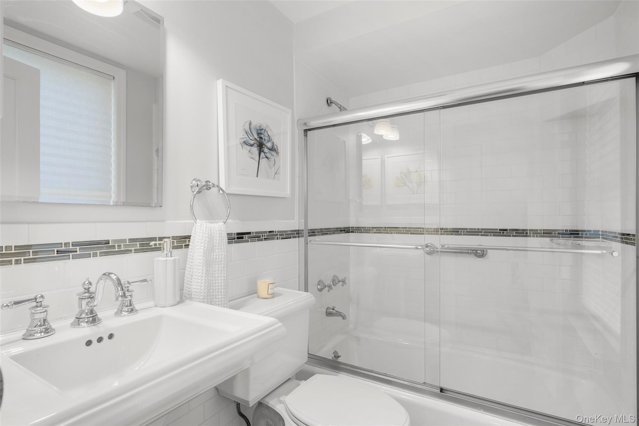 644 Fort Hill Road Scarsdale, NY 10583 - Photo 21 of 42 a bathroom with a sink mirror and a shower