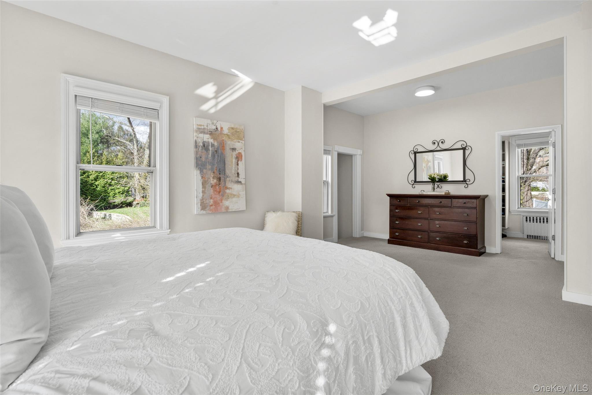 644 Fort Hill Road Scarsdale, NY 10583 - Photo 31 of 42 a spacious bedroom with a bed and a dresser