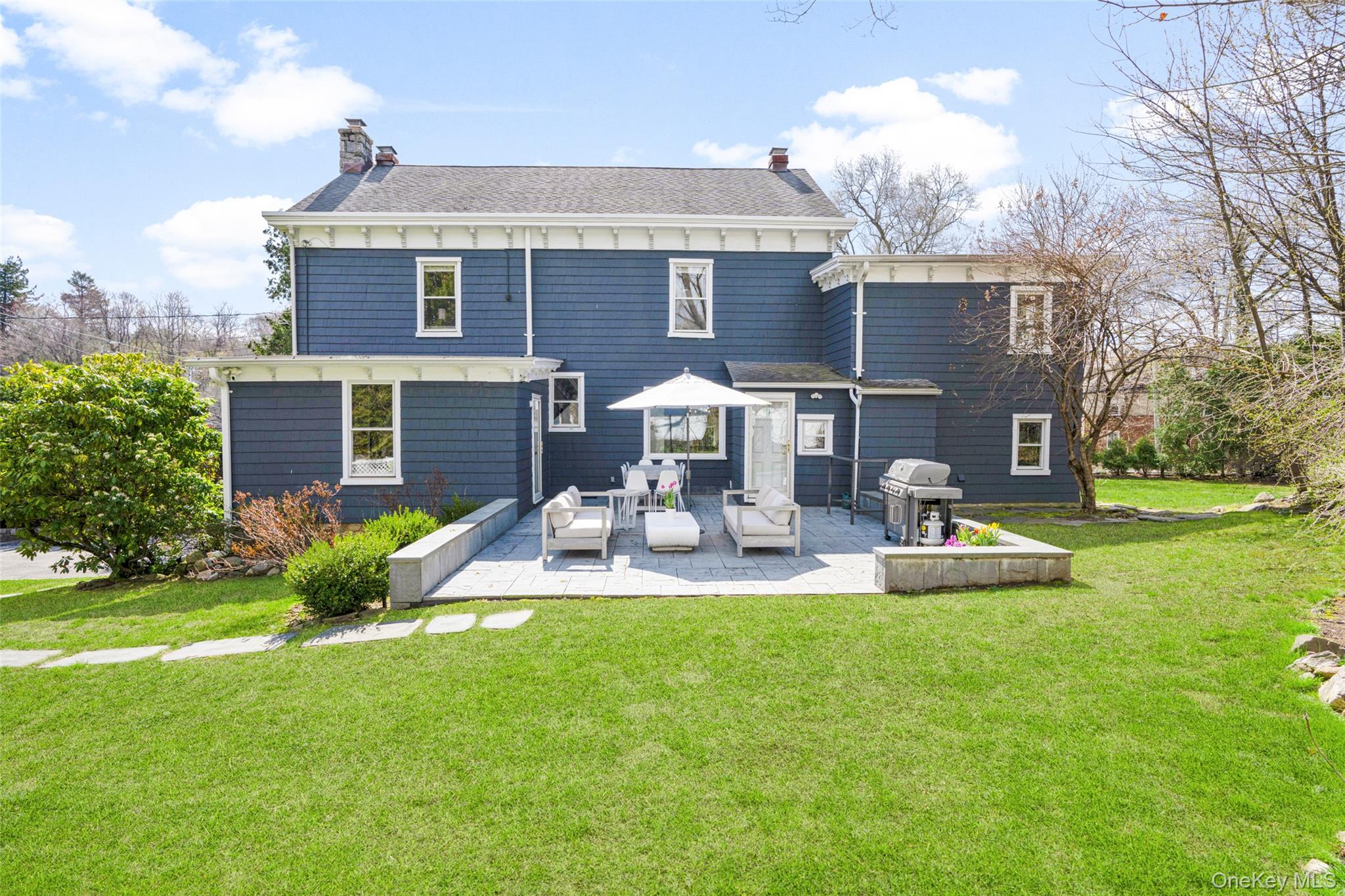 644 Fort Hill Road Scarsdale, NY 10583 - Photo 36 of 42 a view of a house with backyard porch and sitting area