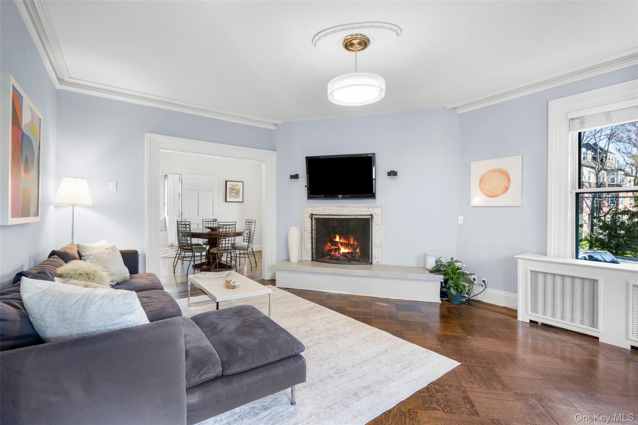 644 Fort Hill Road Scarsdale, NY 10583 - Photo 7 of 42 a living room with furniture a fireplace and a flat screen tv