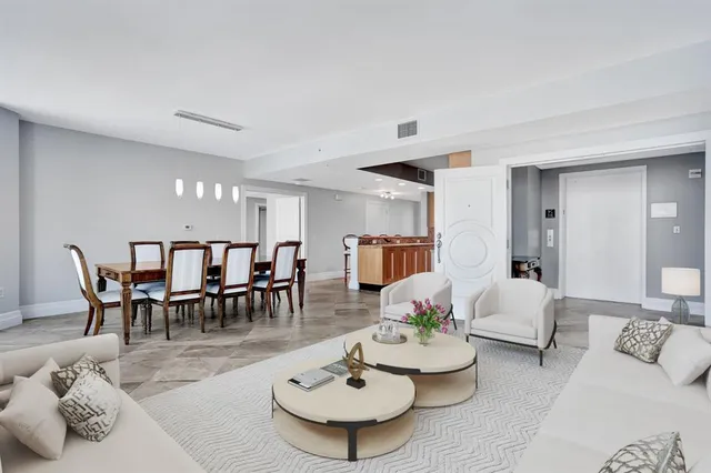 a kitchen with stainless steel appliances granite countertop a refrigerator a stove and cabinets