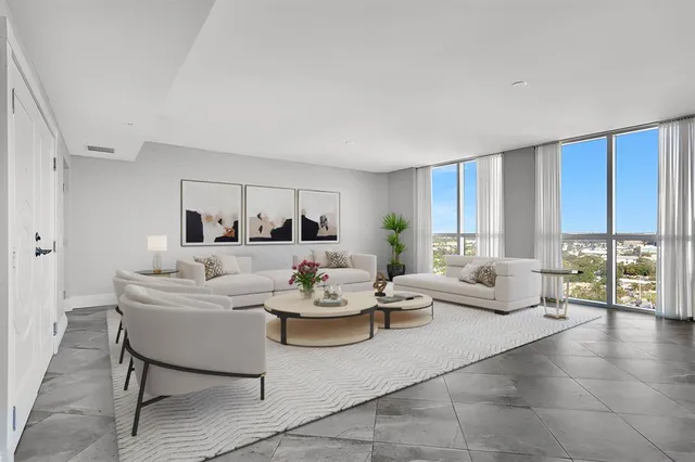 a bathroom with a granite countertop sink and a large mirror