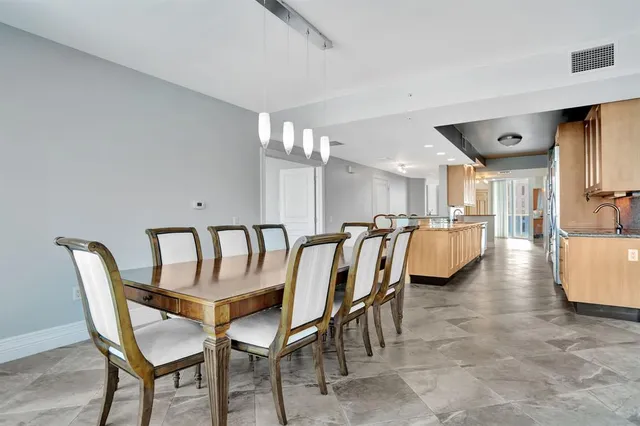 a kitchen with stainless steel appliances a stove a microwave and a refrigerator