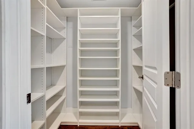 a view of swimming pool with a patio and ocean view