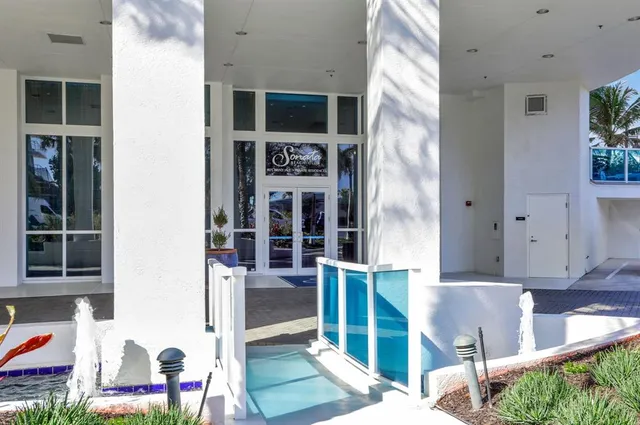 a dining room with furniture and entryway