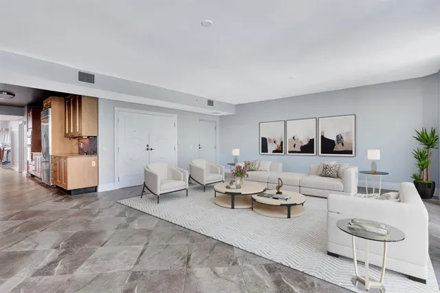 a view of a a dining room with furniture window and wooden floor