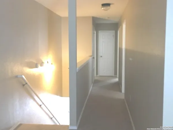 a view of a bathroom from a hallway