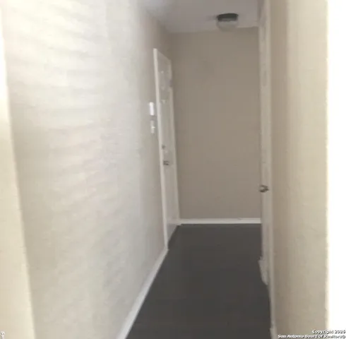 a view of hallway with closet