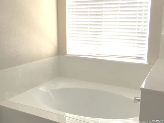 a close up of a bathtub in a bathroom