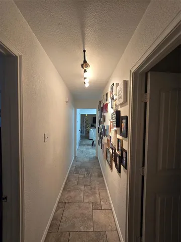 a view of hallway with livingroom