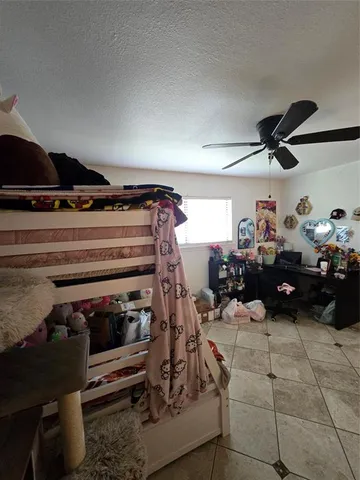 a room with gym equipment and a window