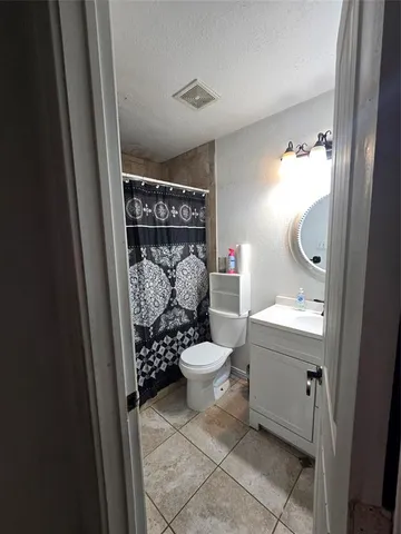 a balcony with furniture and a fireplace