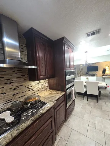 a kitchen with a sink and an oven
