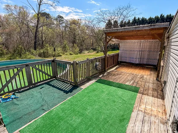 a view of a deck with a yard