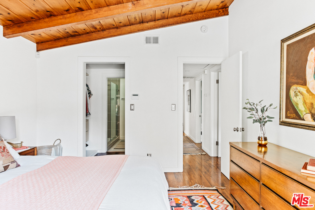 3506 Canyon Crest Road Altadena, CA 91001 - Photo 17 of 25 a spacious bedroom with a bed and a window