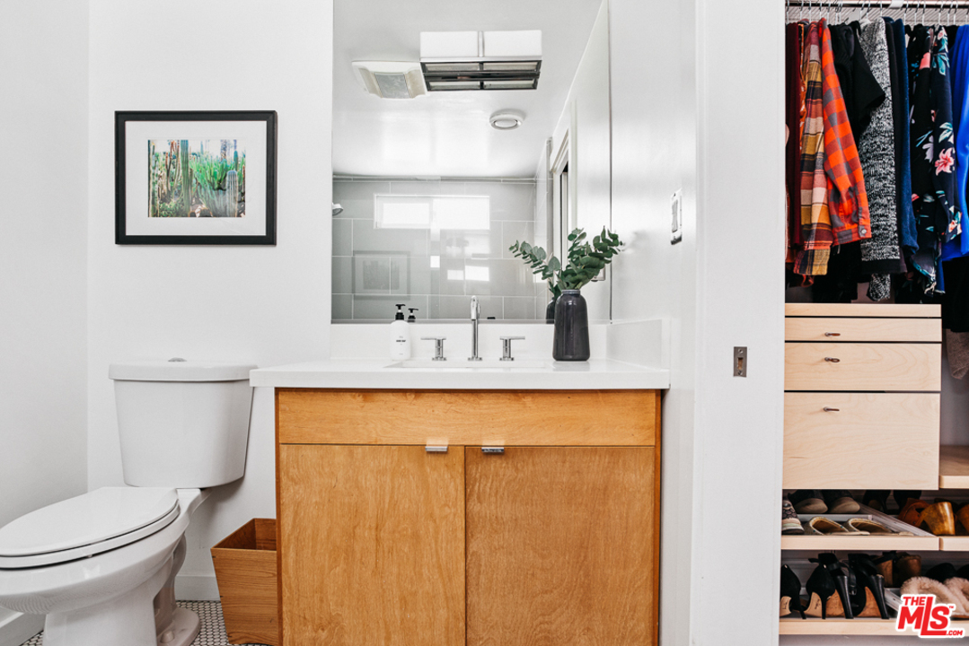 3506 Canyon Crest Road Altadena, CA 91001 - Photo 19 of 25 a bathroom with a sink a toilet and a mirror