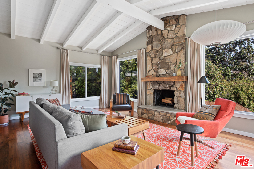 3506 Canyon Crest Road Altadena, CA 91001 - Photo 3 of 25 a living room filled with furniture and a fireplace