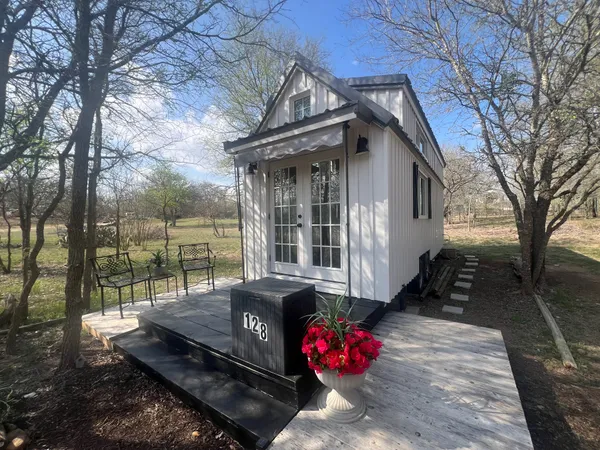 a view of a house with a couches in the patio