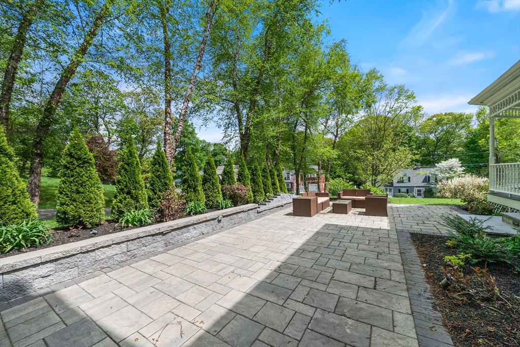 49 Longfellow Road Wellesley, MA 02481 - Photo 7 of 8 a view of a patio with table and chairs and potted plants